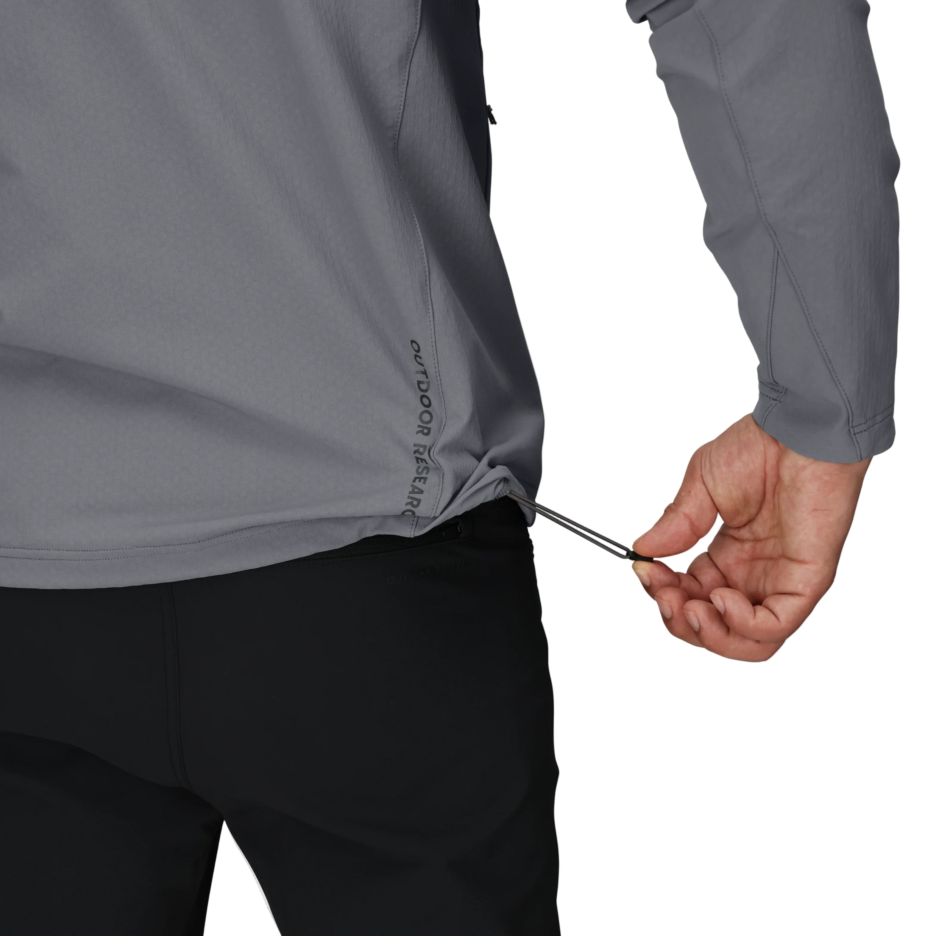 Close-up detail of the Outdoor Research Ultima Soft Shell Hoodie showing adjustable hem cinch, designed to seal out wind and provide a secure, customizable fit for alpine and trail performance.