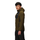 Three-quarter view of the Outdoor Research Vigor Plus Fleece Hoodie in dark olive and black, shown on a model to highlight athletic fit, grid fleece warmth, stretch side panels, and ergonomic hood design for active cold-weather pursuits.