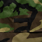 M81 Woodland Camouflage fabric with a Bad Moon Print Press brand label in the center