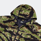 QILO Nordwind WR Browning Jacket in OV Tiger Stripe close-up on hood and AquaGuard zippers | QILO NYC hooded camo streetwear jacket with waterproof DWR finish and 4-way stretch — one of the best hooded camo jackets for tactical and urban wear.