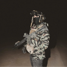 QILO Nordwind WR Browning Jacket in OV Tiger Stripe shown worn kitted up | QILO NYC Tiger Stripe camo streetwear jacket with waterproof DWR finish, 4-way stretch, and AquaGuard zippers - one of the best camo jackets for tactical and range use.