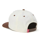 White and brown hat on a white background