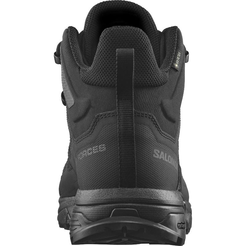 Back and heel view of the Salomon FORCES X Ultra Mid Black showing the reinforced heel counter, tactical non reflective materials, and stability focused Advanced Chassis design built for military use, law enforcement patrol, mountain trekking, and rugged urban operations.