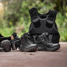 Salomon Forces GENESIS FORCES MID tactical mid boots worn outdoors on rugged terrain, lightweight all terrain military footwear with ripstop upper, Quicklace system, optiFOAM cushioning, and Contagrip outsole built for field operations, range training, and extended duty missions