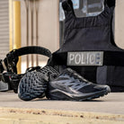 Lifestyle photo of the Salomon Trail Running Shoe in Black being worn during tactical training and field movement. Showcases the lightweight, slip-resistant design ideal for law enforcement, EMS, and outdoor professionals. Built for speed, comfort, and traction on mixed terrain, this hybrid trail running and duty shoe transitions seamlessly from range to street.