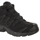 Front angled view of the Black Salomon XA Forces Mid highlighting the Quicklace system and protective tactical boot construction.