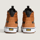 Pair of brown high-top sneakers with white soles on a light gray background