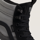 Close-up of a black Vans sneaker with gray side panel on a light background