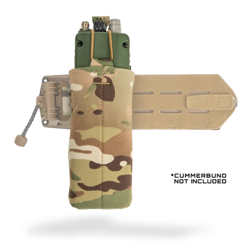 A large radio pouch in a multicam camouflage pattern, shown with a tan MOLLE webbing strap on a white background. A text overlay on the bottom right reads '*CUMMERBUND NOT INCLUDED'.