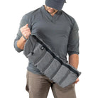 Shaw Concepts ReUp Bandolier held by operator, lightweight crossbody rifle mag carrier with modular magazine storage and utility pockets designed for rapid reload setups, combat gear loadouts, range day training, vehicle staging kits, and law enforcement duty operations made in the USA