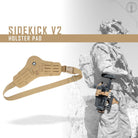 Shaw Concepts Side Kick V2 Holster Pad installed on a tactical holster setup, demonstrating improved comfort, stability, and thigh support during extended wear.