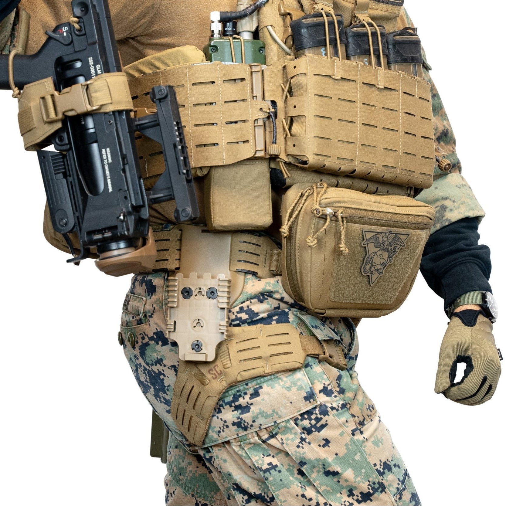 Shaw Concepts Side Kick V2 Holster Pad worn during tactical movement with duty belt and drop leg holster, padded adapter improving comfort and stability for combat gear, military operations, and law enforcement duty setups made in the USA