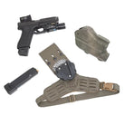 Flat lay of Shaw Concepts Side Kick V2 Holster Pad showing padded drop leg holster adapter with closed cell foam, spacer mesh backing, elastic thigh strap, and dual MOLLE wings for Safariland UBL, True North MHA, and QLS duty gear and combat loadout setups made in the USA