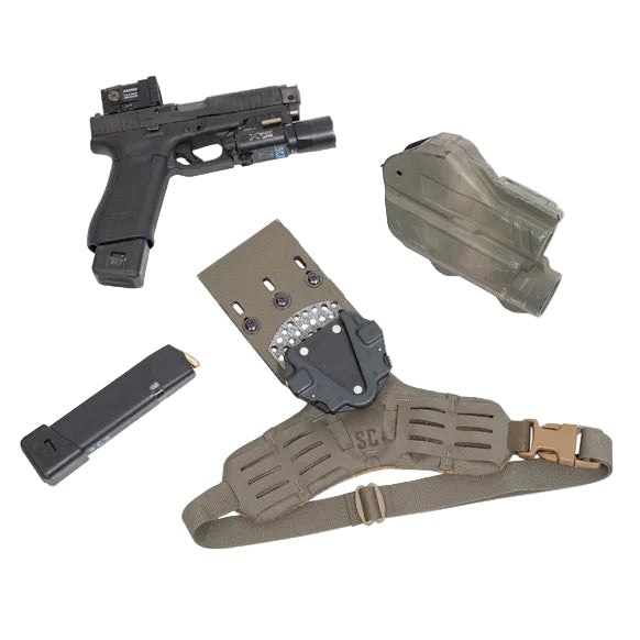 Flat lay of Shaw Concepts Side Kick V2 Holster Pad showing padded drop leg holster adapter with closed cell foam, spacer mesh backing, elastic thigh strap, and dual MOLLE wings for Safariland UBL, True North MHA, and QLS duty gear and combat loadout setups made in the USA
