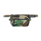 Spiritus Systems BIG Fanny SACK in Woodland camouflage with front zippered pocket, drainage grommets, and adjustable waist strap