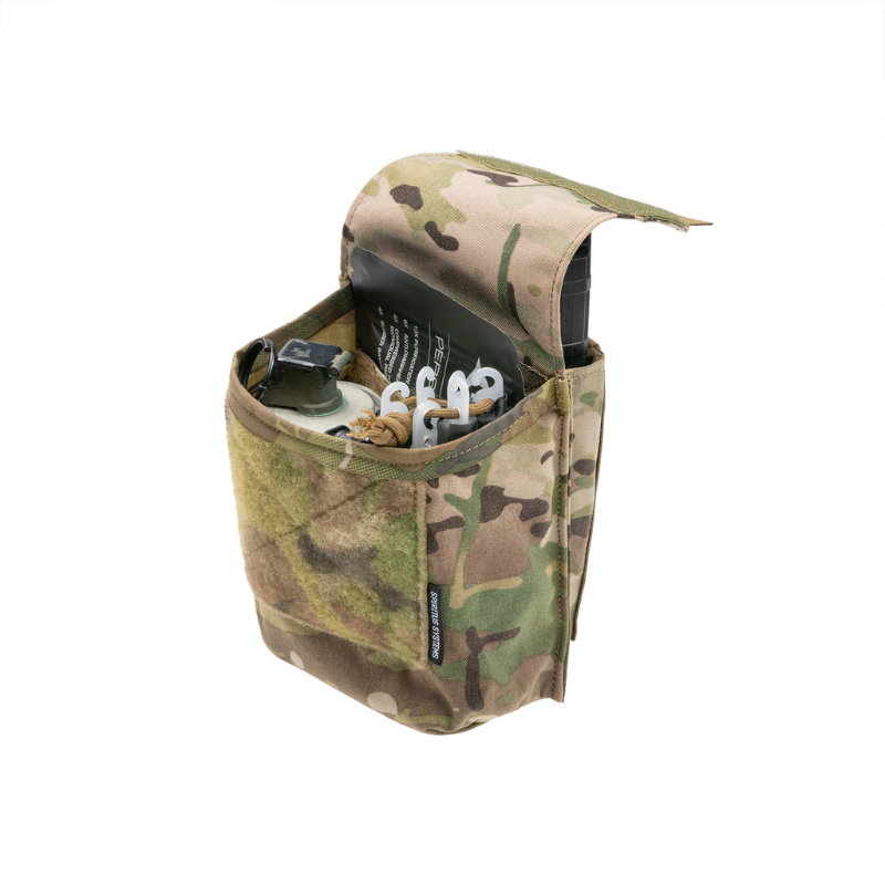 Spiritus Systems JSTA Pouch in Multicam shown open with tactical accessories, tools, and a rifle magazine stored in its compartments.