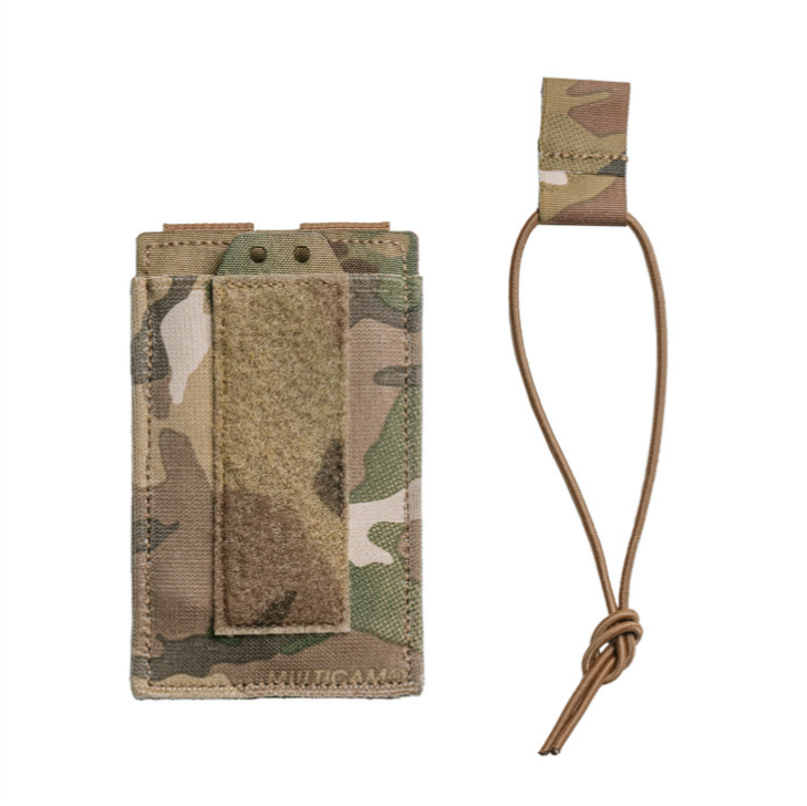 Spiritus Systems EMP Single Elastic Mag Pouch shown with bungee retention strap for added security. MultiCam pouch designed for one 5.56 magazine or mission tools, featuring elastic construction, MOLLE mounting, and loop front panel for Pangolin Flap compatibility.