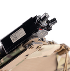 Close-up of the Spiritus Systems EUD Bridge in use, securing an End User Device on a chest rig. Detail view shows stable CURV® composite construction and MOLLE integration for streamlined, mission-ready tech management.