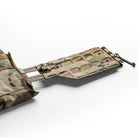 Angled view of Spiritus Systems Reactive MOLLE Tubes Cummerbund mounted to plate carrier, showcasing CURV composite structure, tapered MOLLE layout, and shock cord expansion system for stable yet flexible load bearing performance