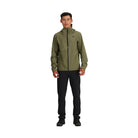 Full body image of the Outdoor Research Stratoburst Rain Jacket in Ranger Green, worn in the field, showing athletic tactical fit and lightweight waterproof shell built for movement