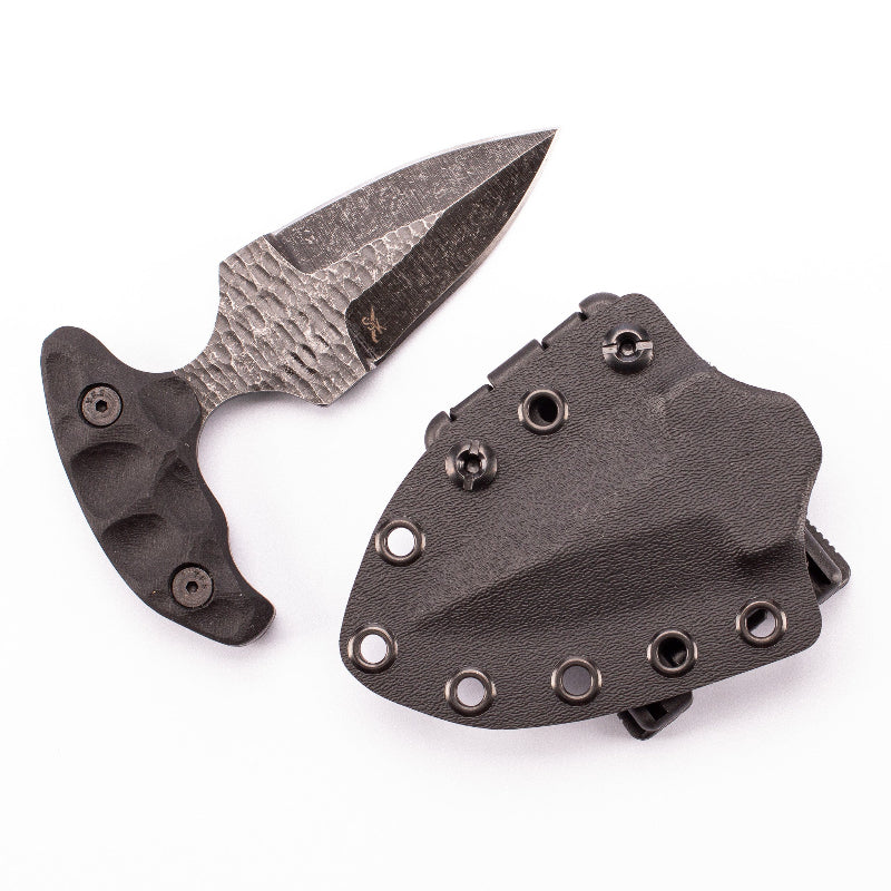Stroup SD1 push dagger tactical knife displayed next to Kydex sheath with belt clip, compact 1095 high carbon steel fixed blade tactical knife for concealed carry, self defense EDC, close quarters defense, and tactical loadout use made in the USA