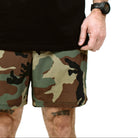 Close up of TD Contender Training Shorts fabric showing micro perforated breathable weave, lightweight quick dry stretch material engineered for airflow, sweat management, and high intensity tactical fitness sessions