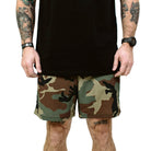 TD Contender Training Shorts in Woodland camo front product photo, breathable tactical training shorts with quick dry stretch fabric, mesh drainage pockets, and athletic 7 inch inseam built for cross training, rucking, and hot weather workouts