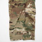 Close-up of TD Cordell Amphib Combat Pants V2 in MultiCam® Agility showing improved hook-and-loop Velcro strap adjustments and reinforced ankle cargo pocket sized for a tourniquet or first aid gear. Amphibious tactical pants built with Brookwood quick-dry fabric for EDC, range training, and field deployments.