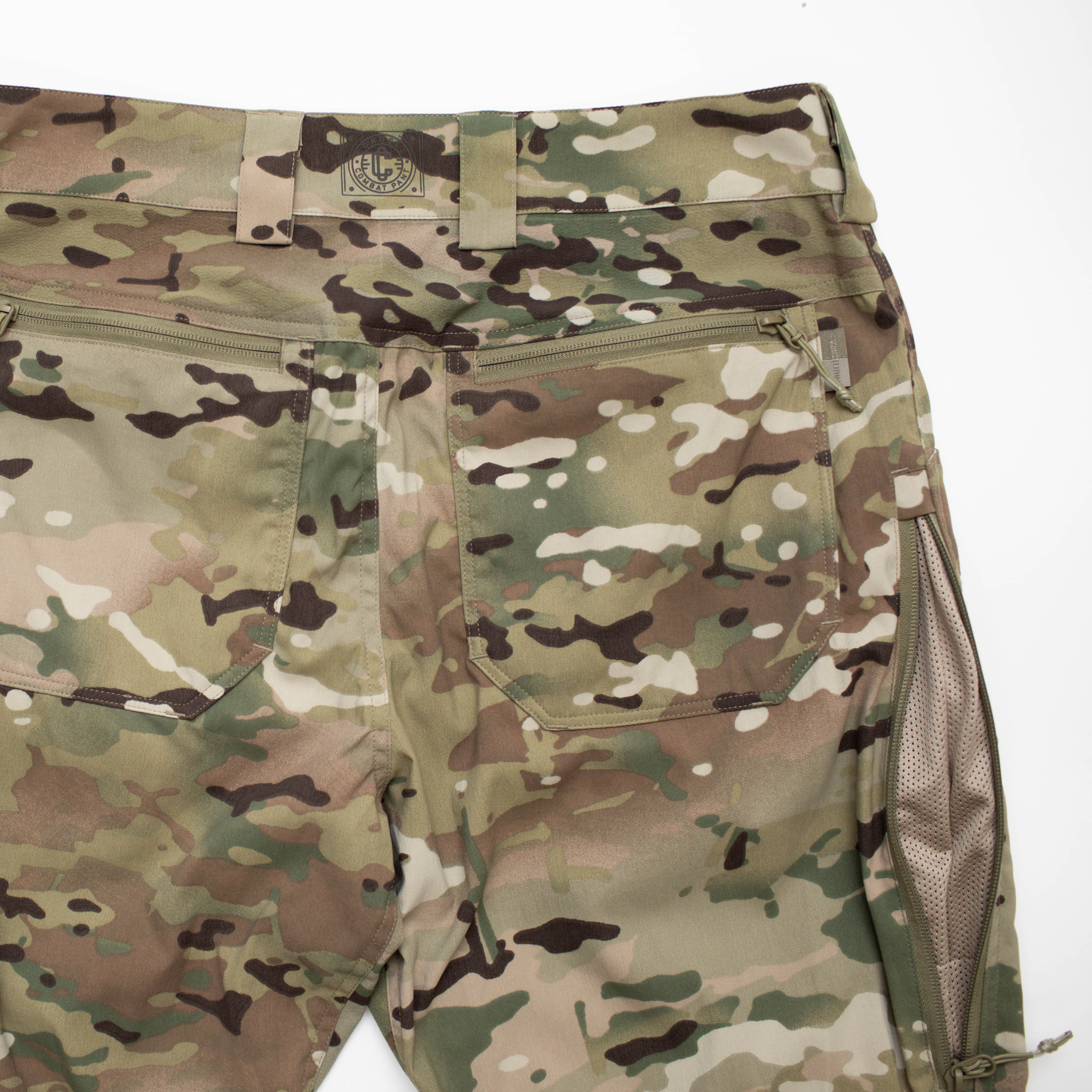 Close-up of TD Cordell Amphib Combat Pants V2 in MultiCam® Agility showing reinforced back zip pockets alongside the mesh-backed side vent for airflow. Amphibious tactical pants engineered with Brookwood quick-dry fabric, ergonomic fit, and EDC-ready storage for range training and field deployments.