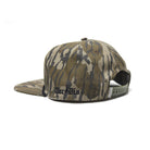 Side profile of the TD Goat Rope Cap in Mossy Oak OG Bottomland highlighting the flat bill, structured crown, and vintage rope hat silhouette.