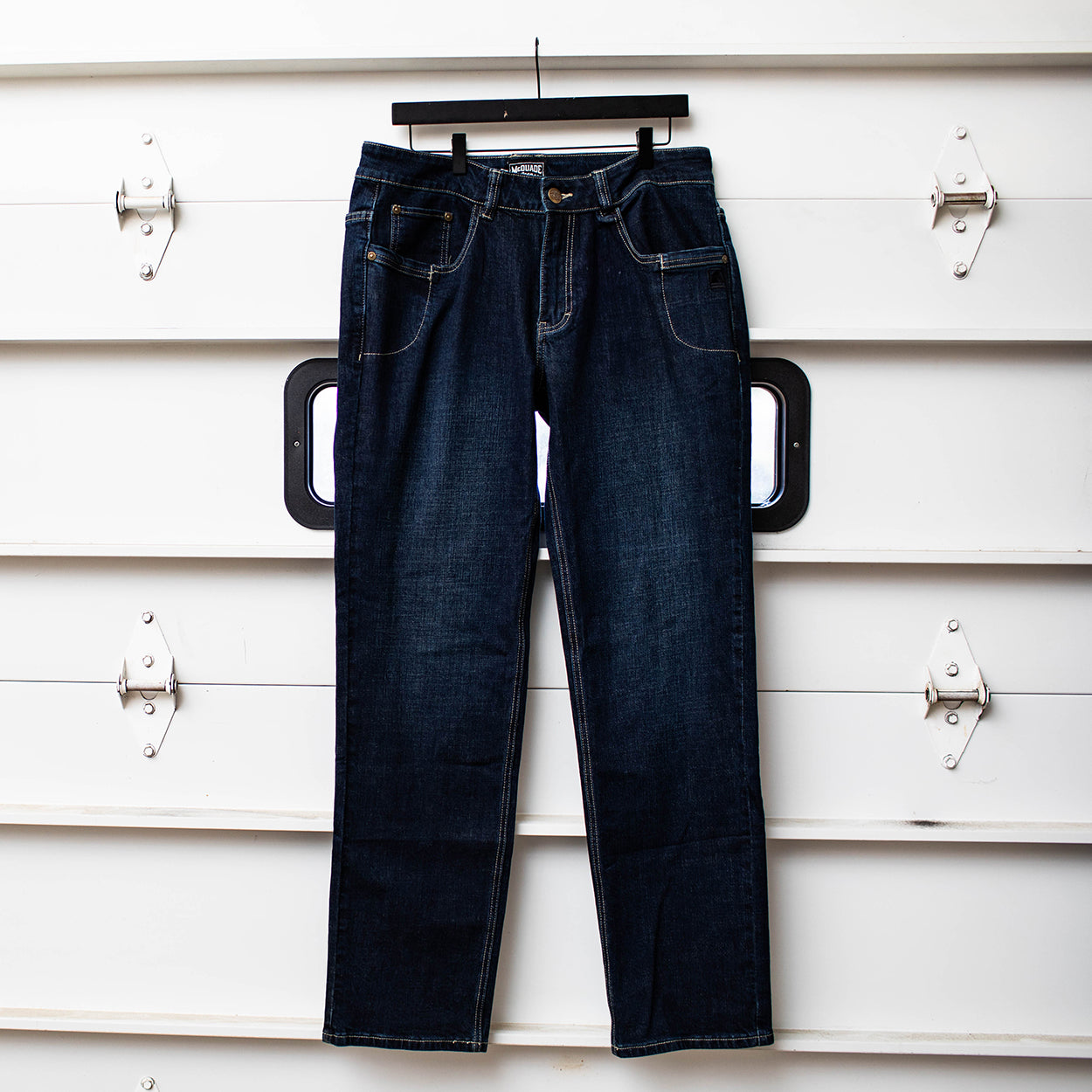 Product shot of the TD McQuade Tactical Jeans in the Deep Sea dark blue wash showing the stretch tactical denim construction, ten pocket EDC layout, concealed carry friendly design, and reinforced build for users searching for the best tactical jeans and everyday carry pants.