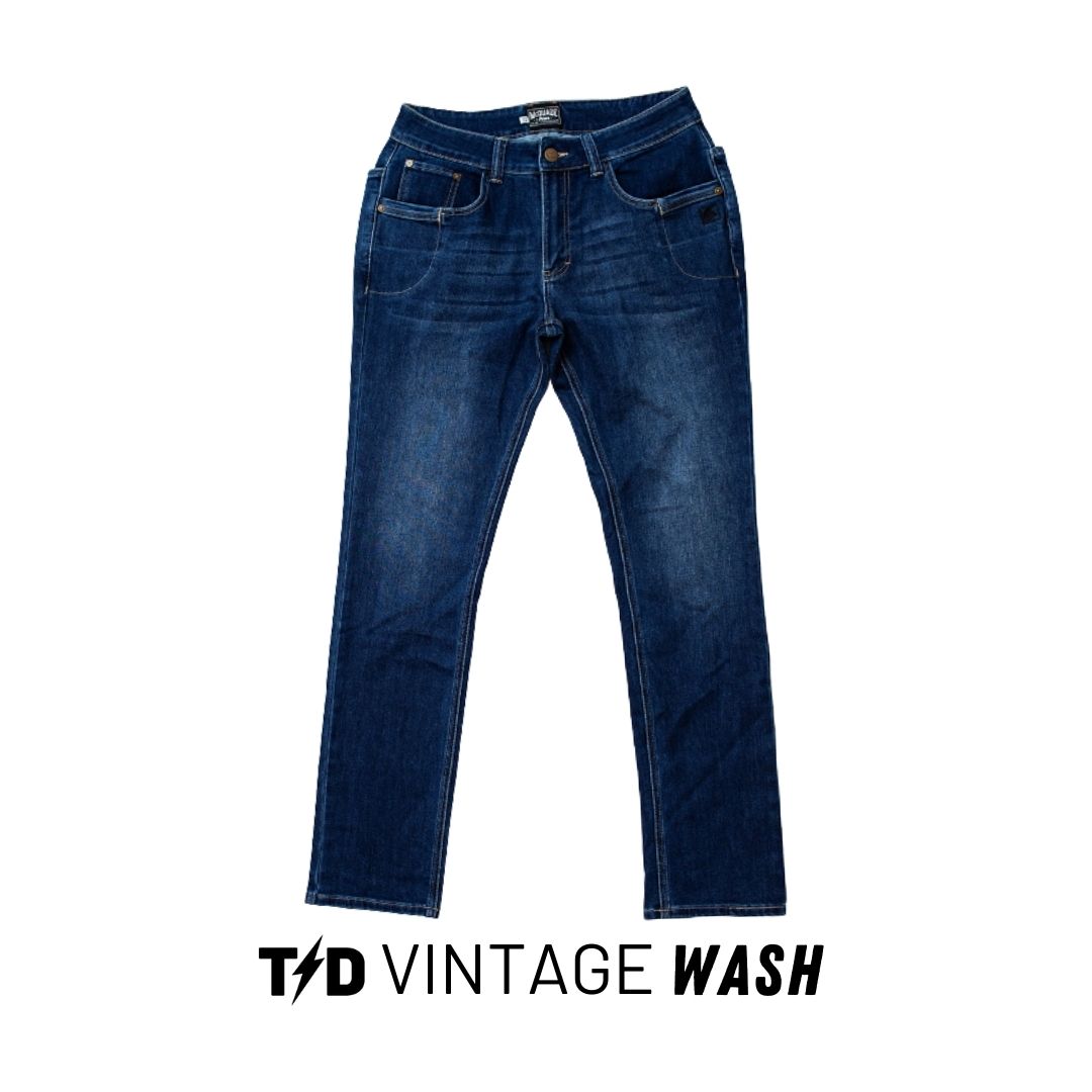 TD McQuade Tactical Jeans V2 in Bold Blue Vintage wash displayed in a clear product shot, showcasing the bright worn denim finish, stretch mobility, reinforced pocketing, and the 10 pocket EDC system designed for concealed carry and everyday tactical use.