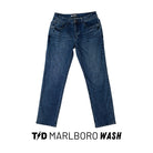 TD McQuade Tactical Jeans V2 in Marlboro Wash, featuring a rich vintage tinted denim tone, displayed in a full product view highlighting the stretch construction, reinforced pockets, and 10 pocket EDC system designed for concealed carry and everyday tactical functionality.