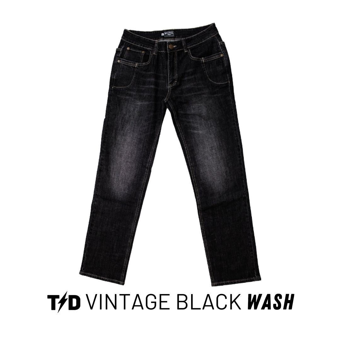 TD McQuade Tactical Jeans V2 in Vintage Black wash shown in a clean product view, highlighting the faded black denim finish, durable stretch construction, reinforced knife and mag pockets, and the full 10 pocket EDC layout built for concealed carry and everyday tactical performance.