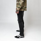 On body view of the TD McQuade Tactical Jeans in the Vintage Black wash slim cut showing the stretch tactical denim fit, concealed carry friendly waistband, discreet EDC pocket access, and low profile tactical design for users searching for the best tactical jeans, CCW jeans, and everyday carry pants.