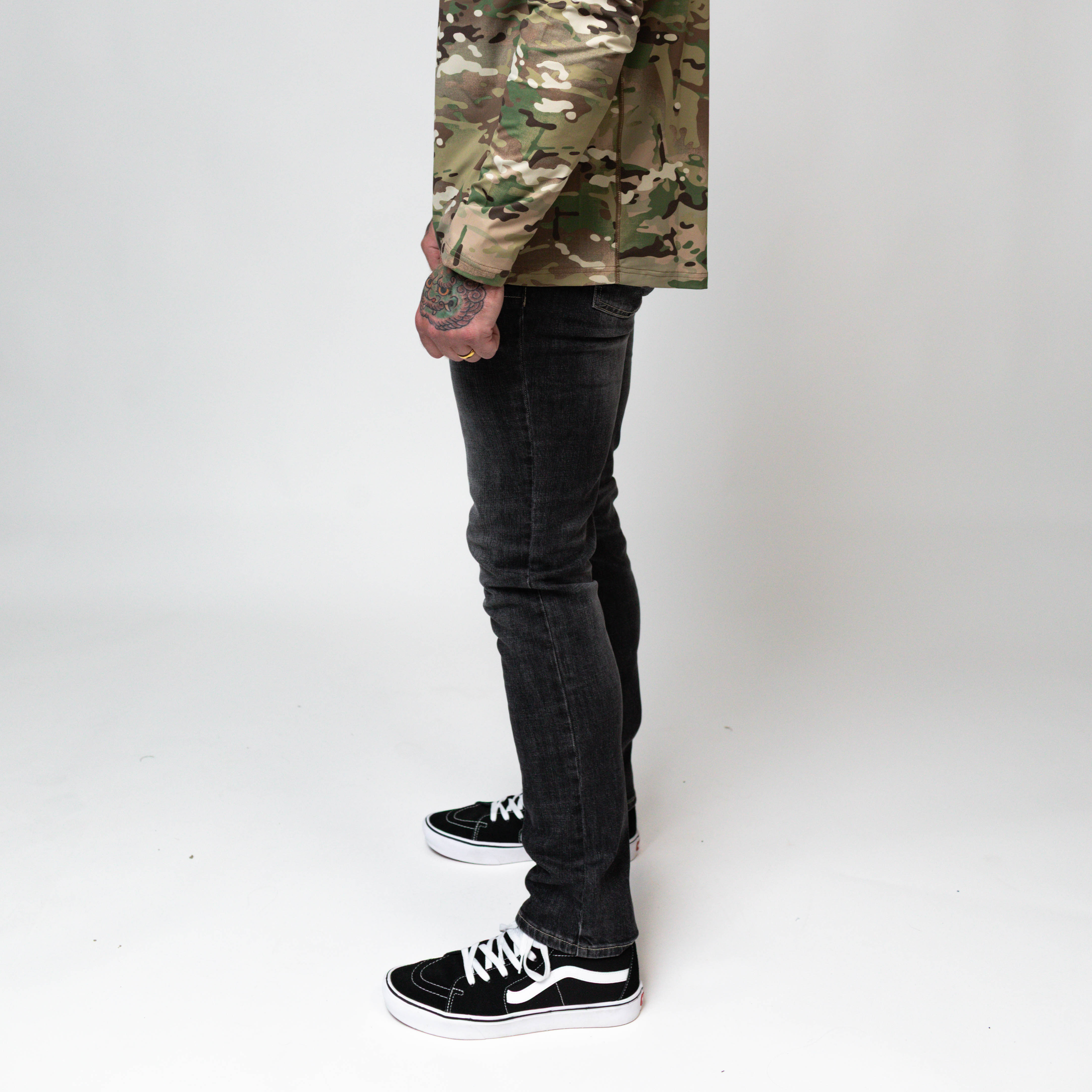 On body view of the TD McQuade Tactical Jeans in the Vintage Black wash slim cut showing the stretch tactical denim fit, concealed carry friendly waistband, discreet EDC pocket access, and low profile tactical design for users searching for the best tactical jeans, CCW jeans, and everyday carry pants.