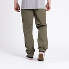 Back view of TD Neptune Amphibious Tactical Performance Pants in True Ranger Green highlighting rear zippered pockets, articulated seat, mesh drain holes, and quick-dry ripstop fabric for amphibious EDC and tactical performance on land and in water