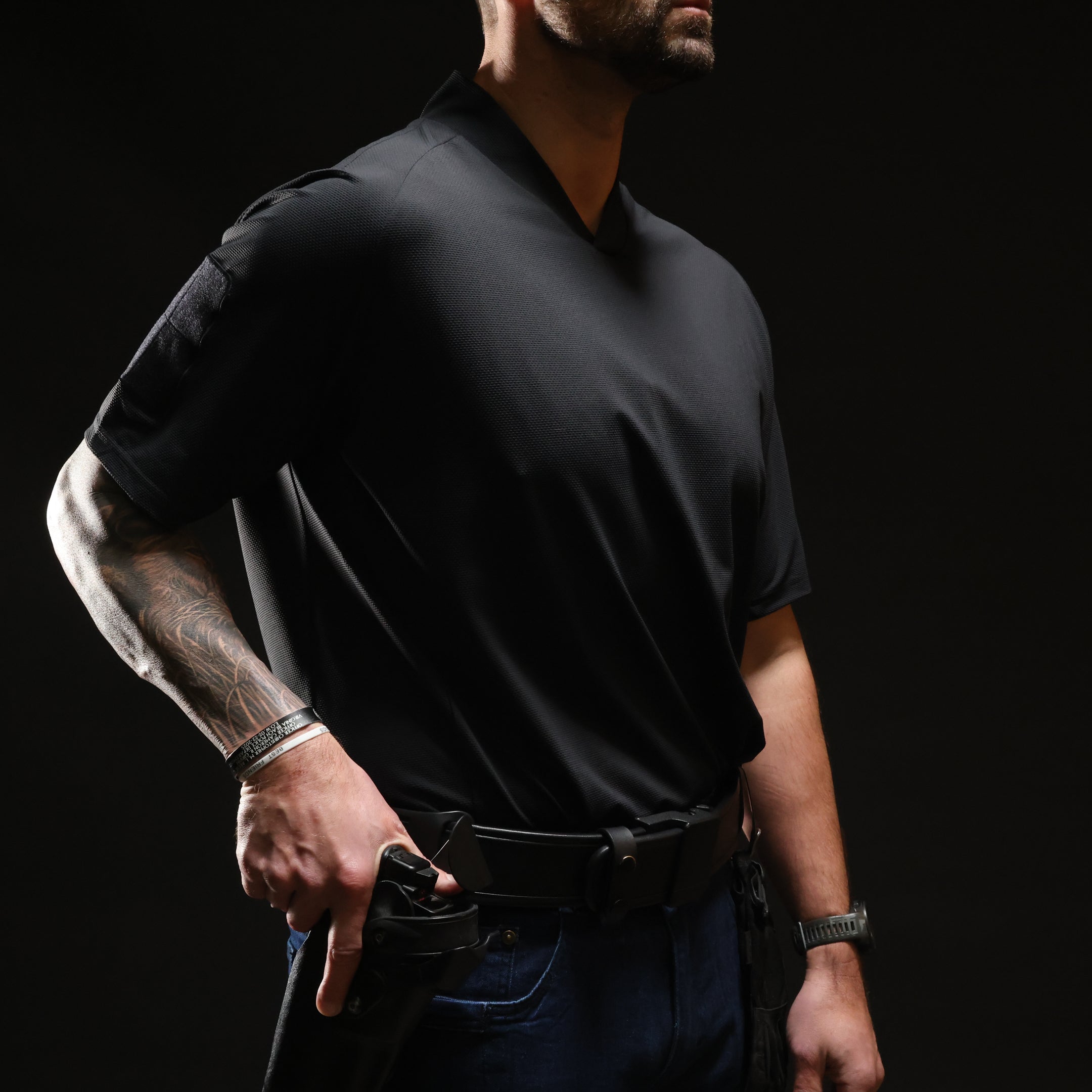 Operator wearing TD OSS Top Short Sleeve in Coyote one size up for a looser fit during range training, lightweight tactical range shirt and combat base layer built for hot weather drills, shooter movement, and professional field use under kit