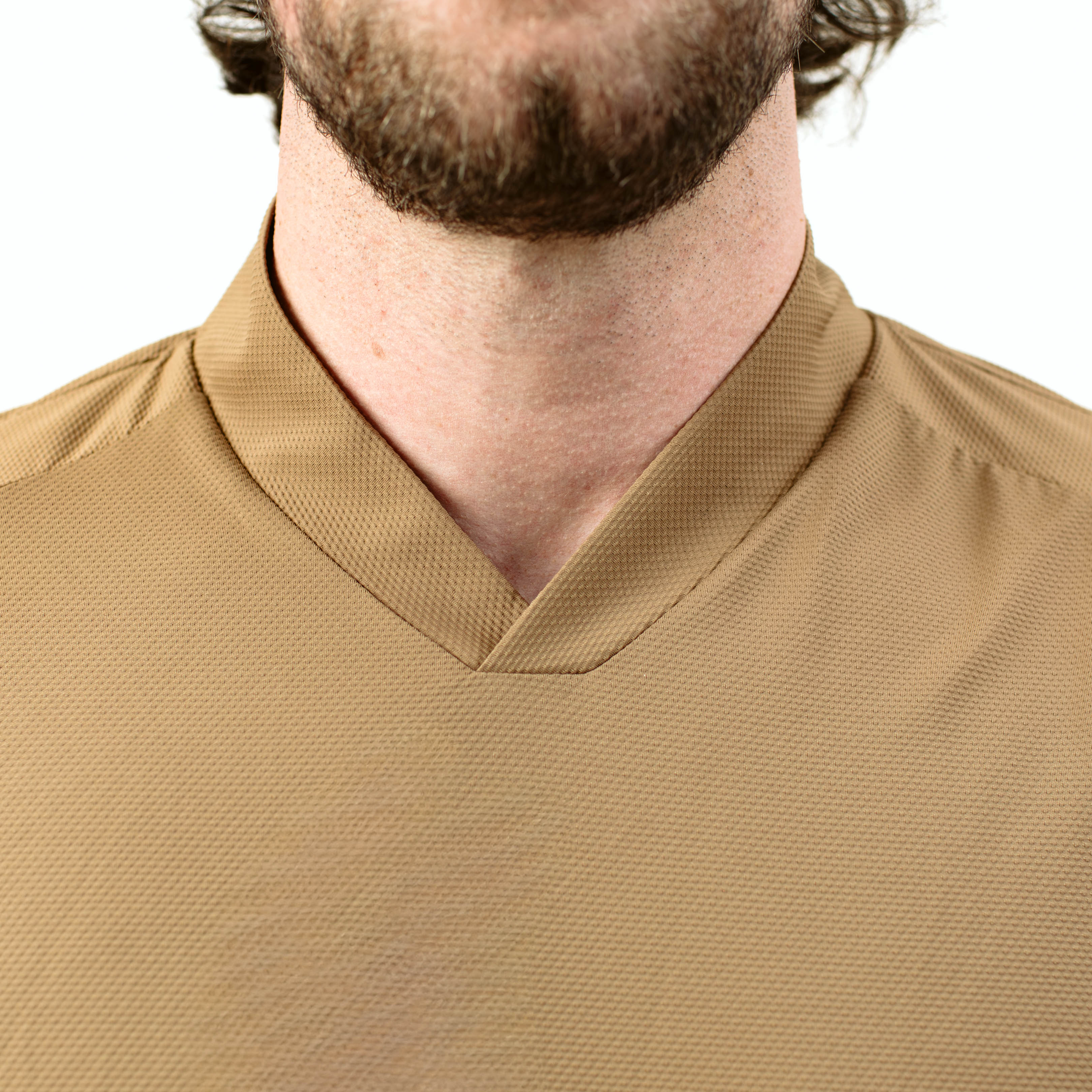 Close up of TD OSS Top Short Sleeve in Coyote showing redesigned V neck collar for sling protection and hot brass defense, breathable operator range shirt built for hot weather combat training and duty wear