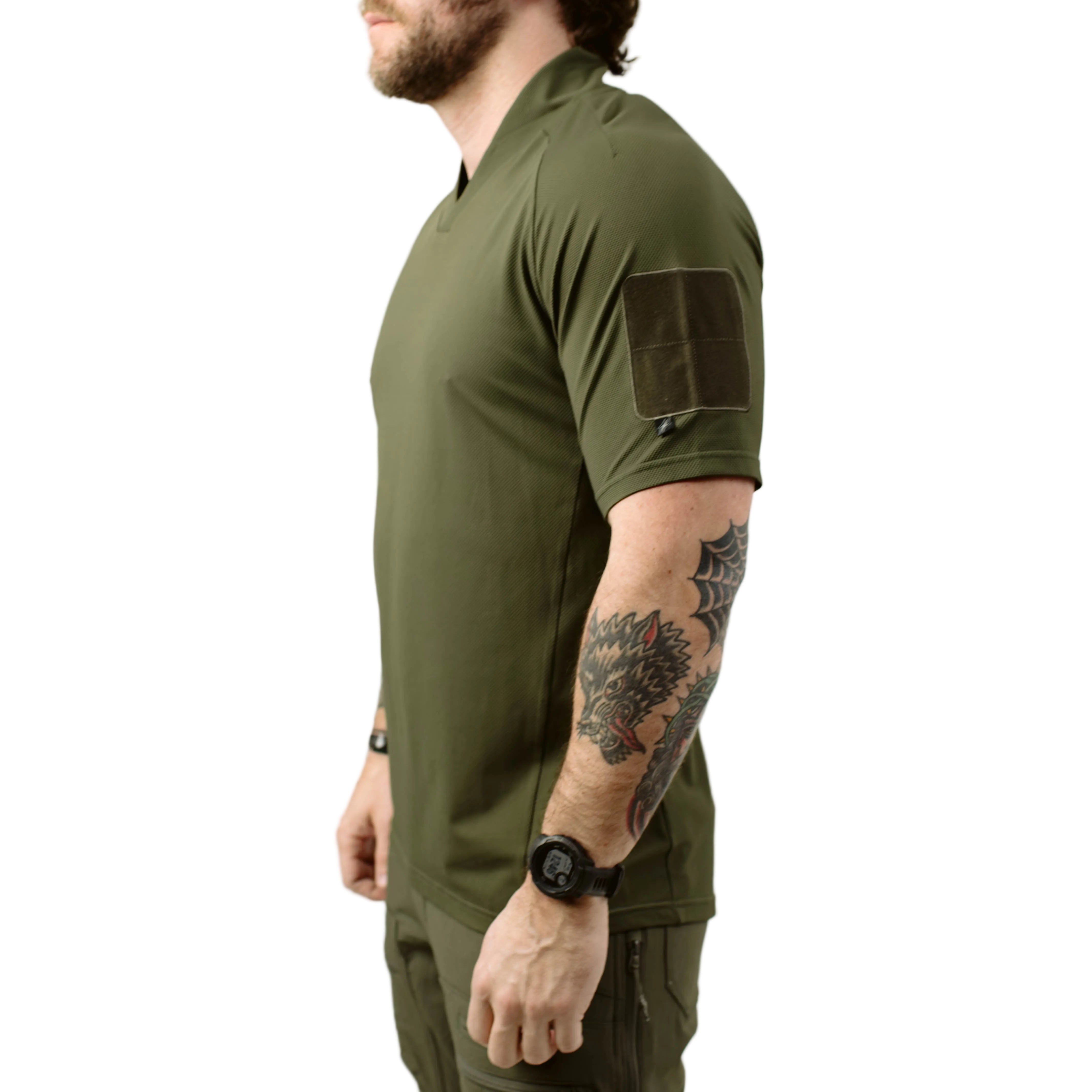 Side view of TD OSS Top Short Sleeve in Ranger Green showing athletic performance fit, raglan sleeve articulation, and low profile bicep loop field, breathable tactical range shirt built for warm weather training and operational use
