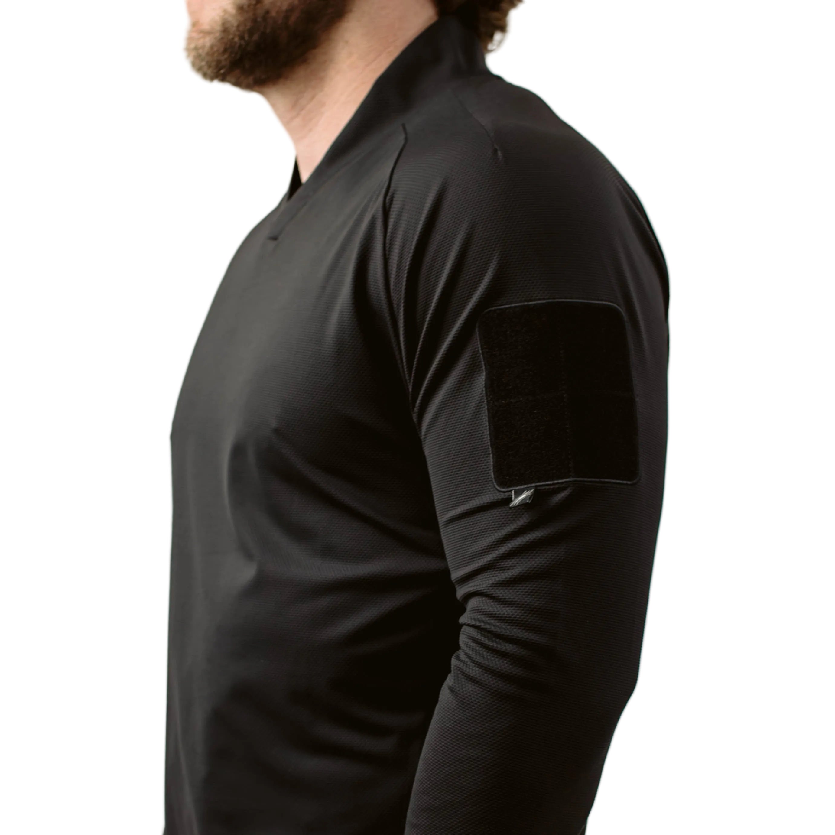 Side and arm view of TD OSS Top V2 Long Sleeve in Black showing low profile bicep loop patch field, raglan sleeve articulation, and athletic combat base layer fit, lightweight operator top and shooter shirt built for range training, duty use, and wear under plate carriers