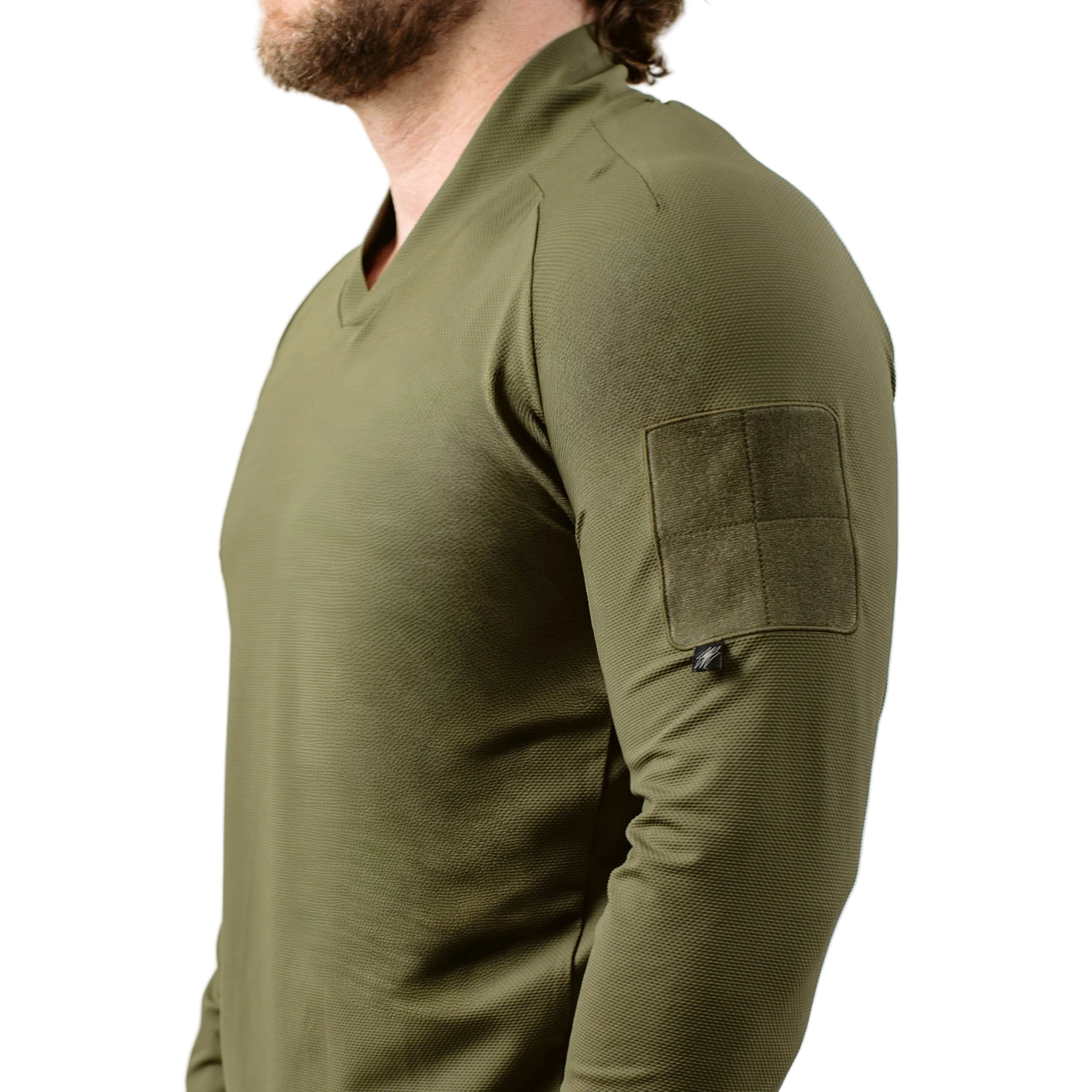 Side view of TD OSS Top V2 Long Sleeve in Ranger Green showing athletic combat base layer fit, raglan sleeve mobility, and low profile bicep loop field, lightweight operator top and shooter shirt built for range training and duty wear under plate carriers