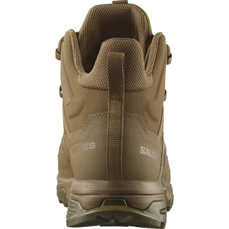Back view of the Salomon FORCES X Ultra Mid in Coyote showing the reinforced heel counter, non reflective tactical materials, and stability focused Advanced Chassis design built for military duty, law enforcement use, mountain trekking, and rugged outdoor operations.
