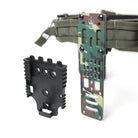 Side view of the True North Concepts Modular Holster Adaptor in the TD Exclusive Woodland finish installed on a tactical belt, highlighting the adjustable ride height and rigid mounting system.