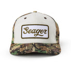 Camouflage and white cap with 'Seager' logo on a white background