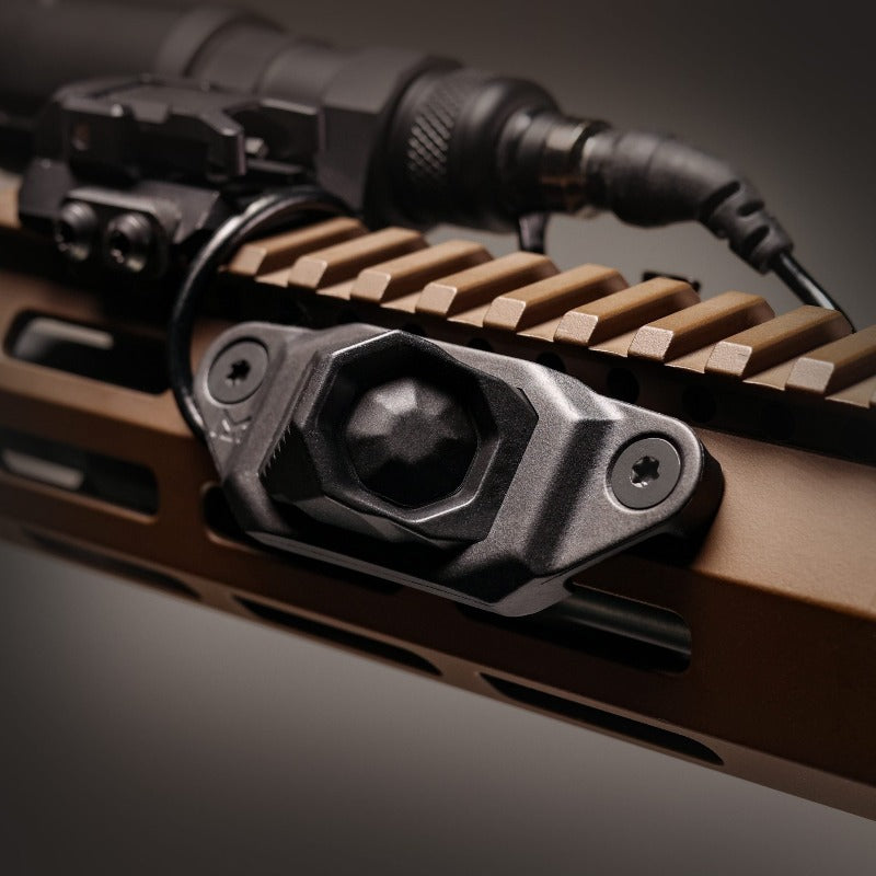 Unity AXON™ SL M-LOK Mounting Kit in Black shown mounted to an M-LOK handguard with AXON SL remote switch attached, demonstrating low-profile, snag-free remote switching for tactical rifles. Lightweight high-impact polymer frame secures the switch for reliable operation during dynamic movement and weapon transitions.