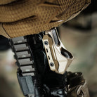 operator activating Unity AXON SYNC switch controlling weapon light and DBAL laser during range use