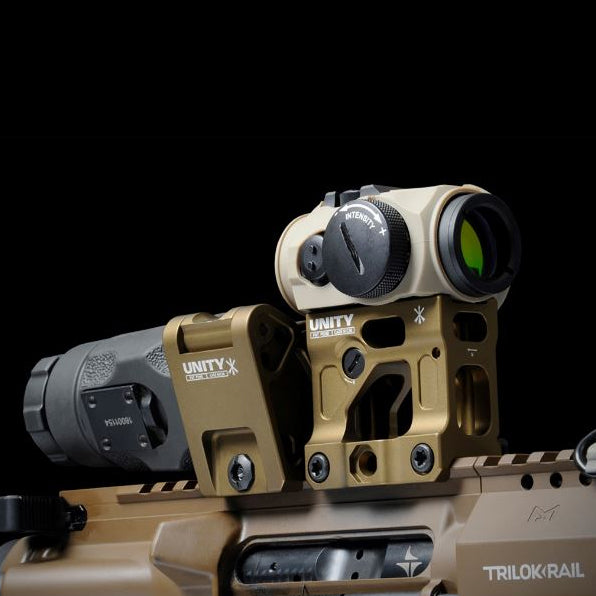 Unity FAST Aimpoint Magnifier Mount installed on tactical rifle with magnifier flipped down in shooting position aligned behind red dot
