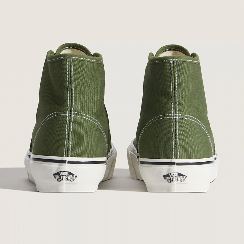 Green high-top sneakers with white soles on a light gray background