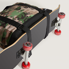 Camouflage backpack with skateboard design on a light gray background